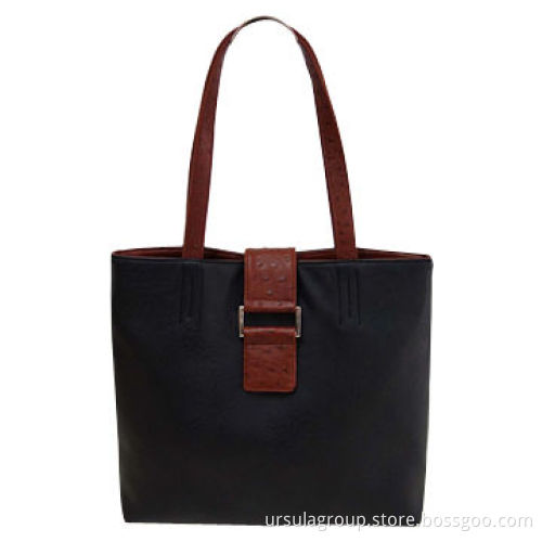 Fashionable shopper bag with big square buckle tab on front